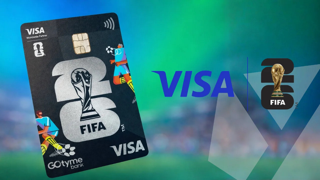 Visa credit card with FIFA World Cup branding and trophy emblem against a blurred stadium background